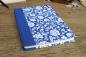 Preview: Notebook, sturdy blue cover with white flowers, blue linen spine